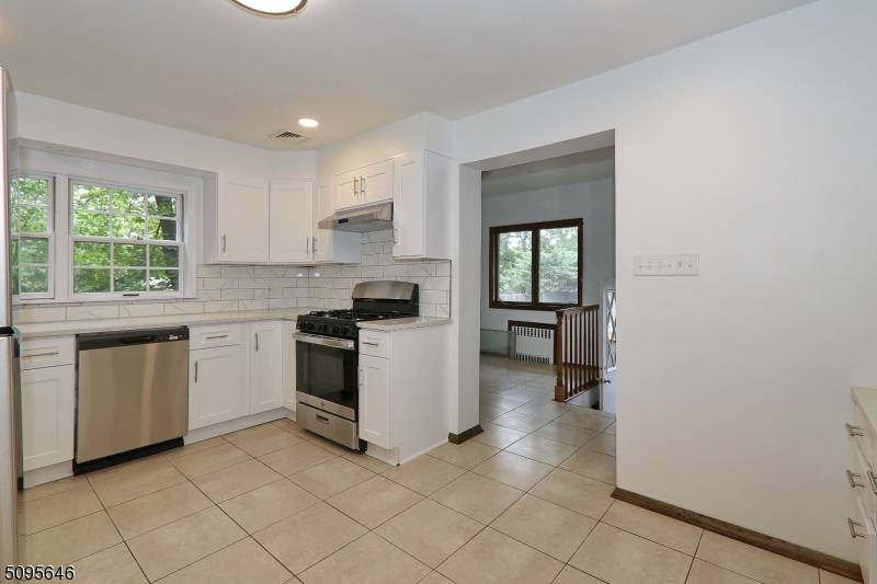 Renovated 3BR 2. 1 bath townhouse duplex style unit in a side by side two family available for rent immed.