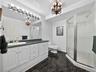 Tasteful fully finished bathroom in the basement.