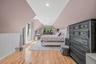 Bedroom featuring light wood finished floors, lofted ceiling, and recessed lighting