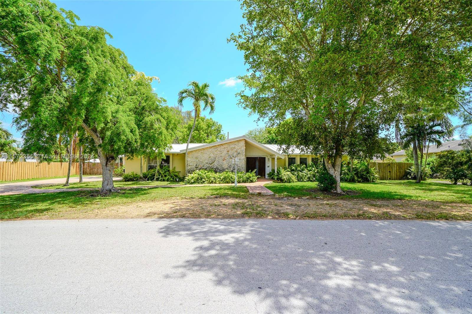 This Palmetto Bay 4 bedroom, 3 bathroom home with a 1 bedroom 1 bathroom, 2004 built guest house, pool home is gracefully situated along a tranquil canal.