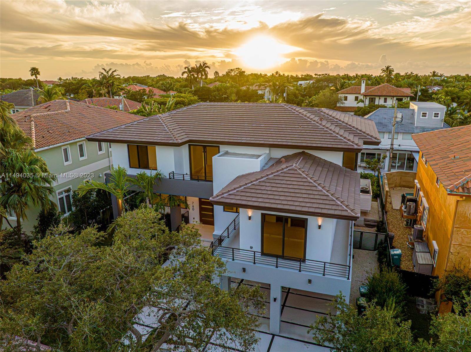 Indulge in luxury at this READY TO MOVE Key Biscayne home on Woodcrest Rd.