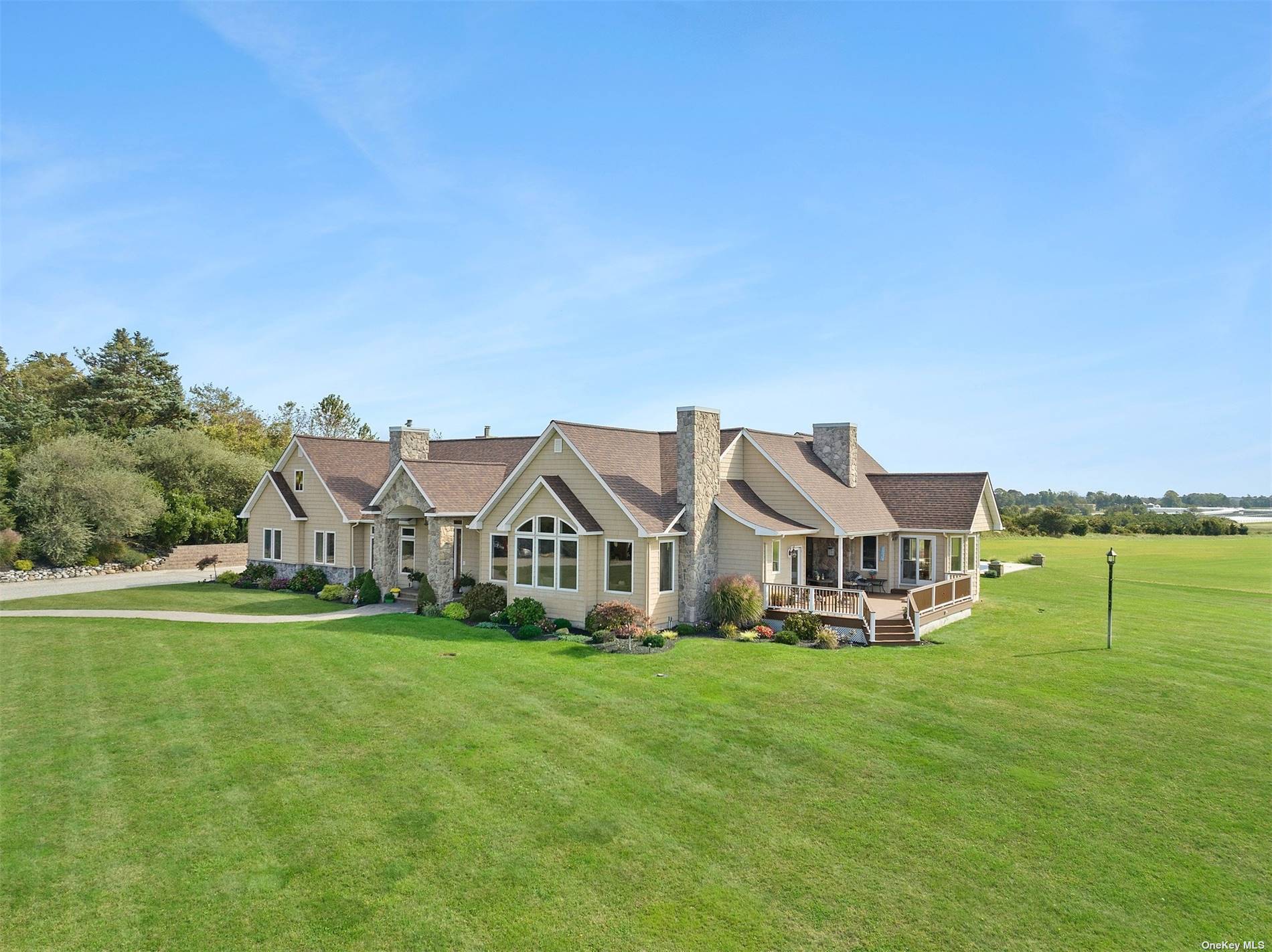 A long winding driveway rises to this spectacular 56 acre property and beautifully built five bedroom 3.