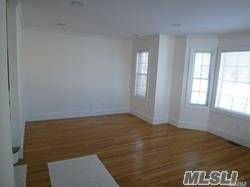Spacious Duplex featuring living room, dining area, eat in kitchen and powder room.