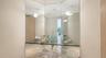Half bathroom positioned just off the open-concept great room and circular kitchen