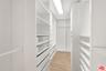 Large walk-in closet of primar