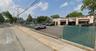 View of asphalt street with sidewalks