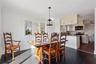 Dining area featuring ornamental molding, dark hardwood / wood-style floors, and ceiling fan