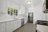 Another view of the kitchen which is spacious and has a lot of cabinets (#222)