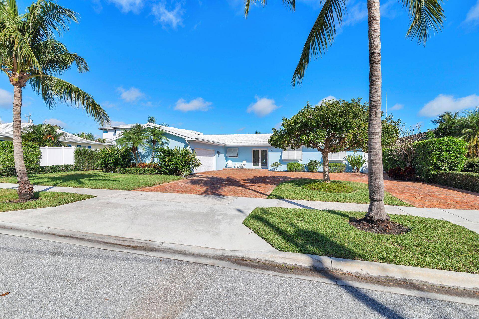 Open and airy, this magnificent Lake Worth Beach waterfront home was built for entertaining !
