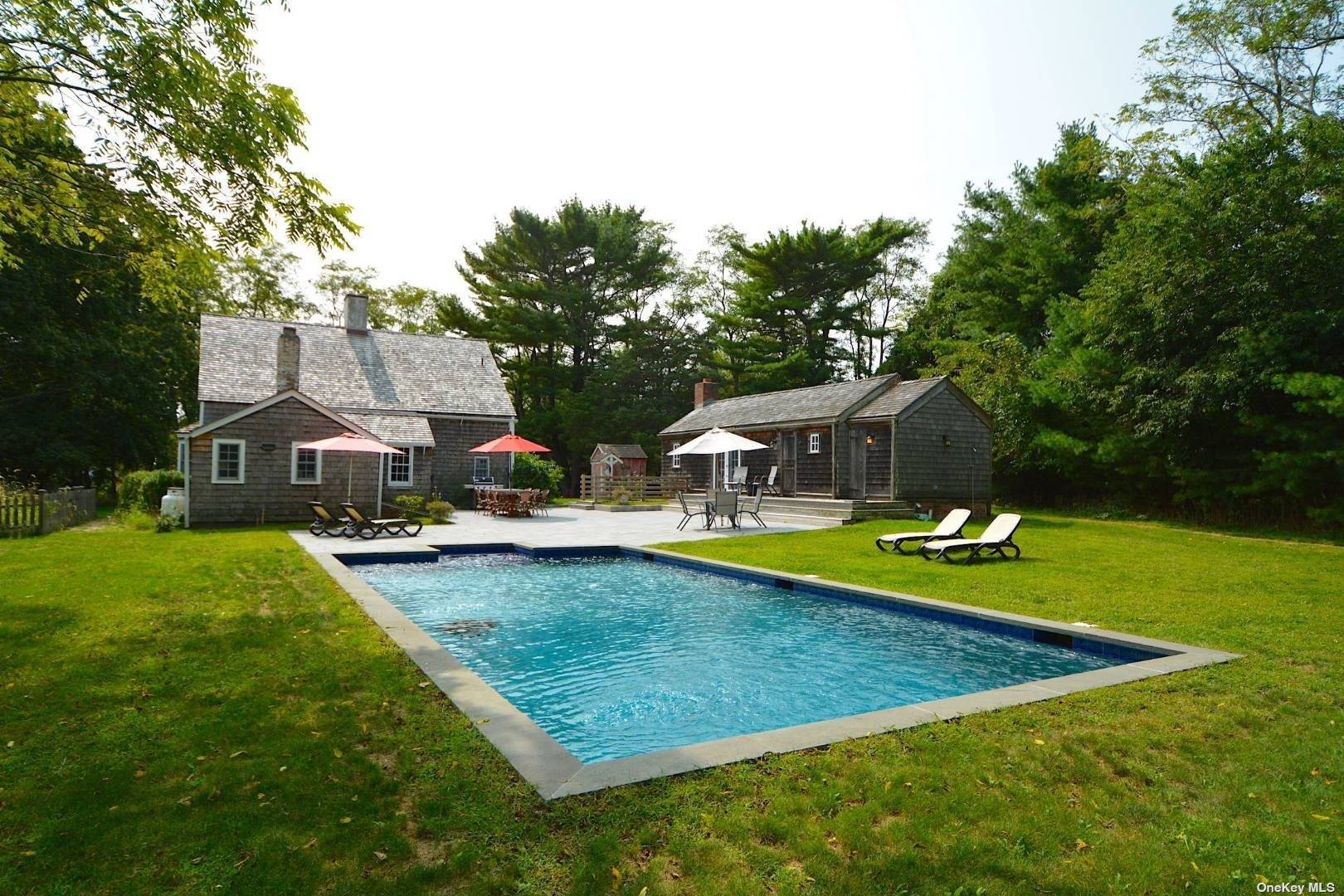 Magnificently restored historic farmhouse with heated, Gunite pool on private, shy 2 acres.