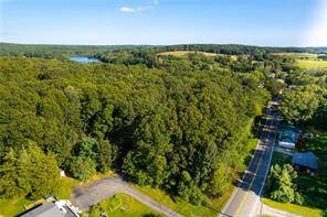 Nicely wooded approved building lot with hilltop setting and great views.