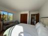 Bedroom featuring a closet and wood finished floors