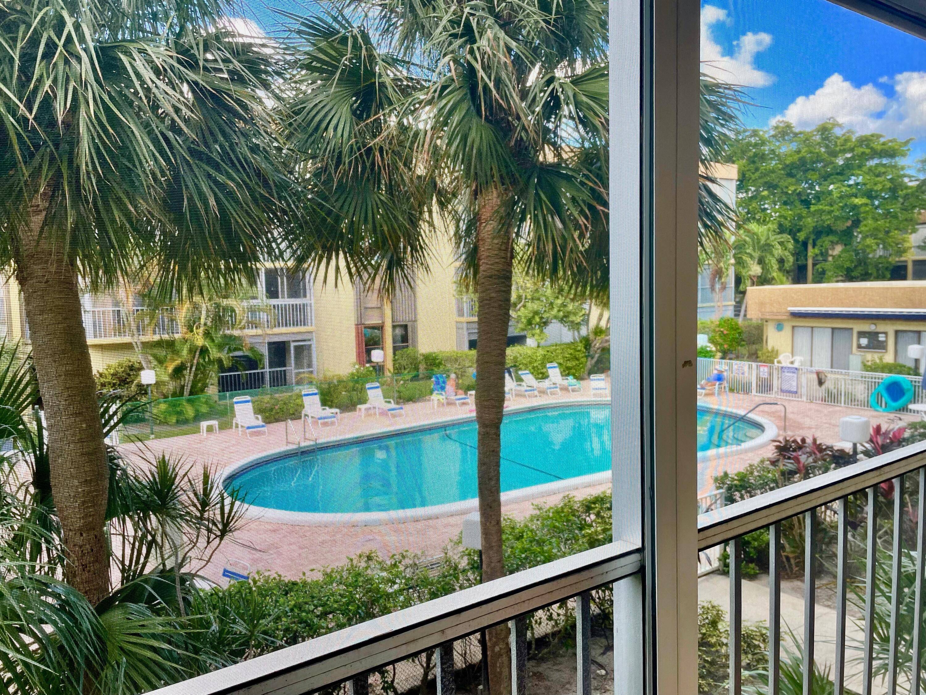 Beautiful 2nd floor condo with serene views to pool grounds.
