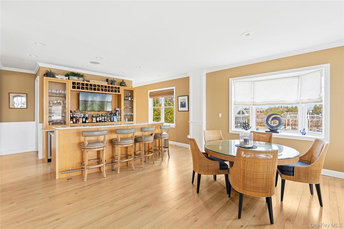 Wet Bar with Seating and Additional Dining Area