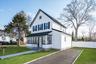 View of front of house featuring a sunroom