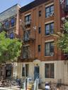 View of apartment building / complex featuring cooling unit