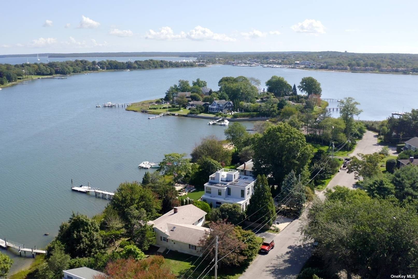 Welcome to 43 Harbor Drive, located in Sag Harbor's prestigious waterfront community of Bay Point.