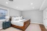 Bedroom featuring baseboards, wood finished floors, visible vents, and recessed lighting