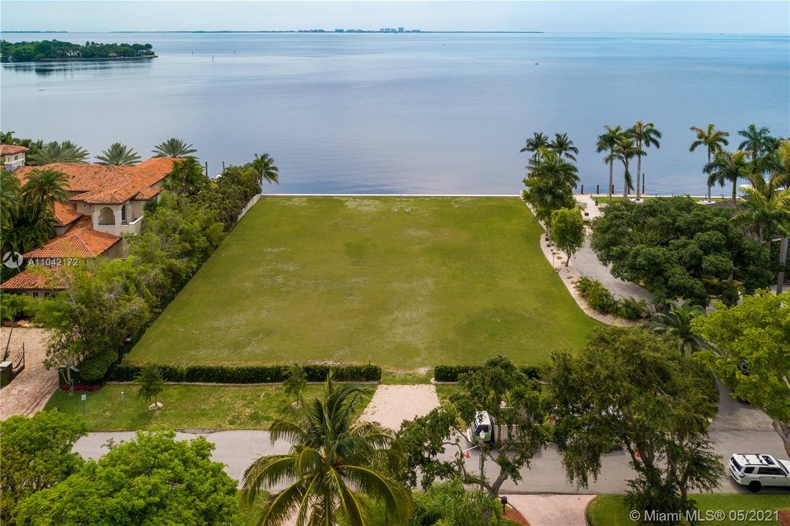 Rare opportunity to own a stunning bay front lot in Old Cutler Bay with amazing views looking east towards Key Biscayne.