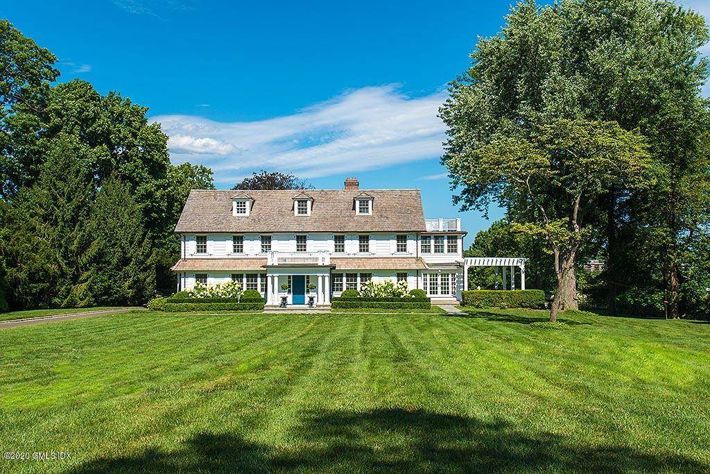Quintessential Connecticut colonial superbly renovated with ultimate style in a park like, gated setting on the Belle Haven peninsula with stunning water views of Greenwich Harbor and beyond.