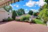 Brick patio with retractable electric awning