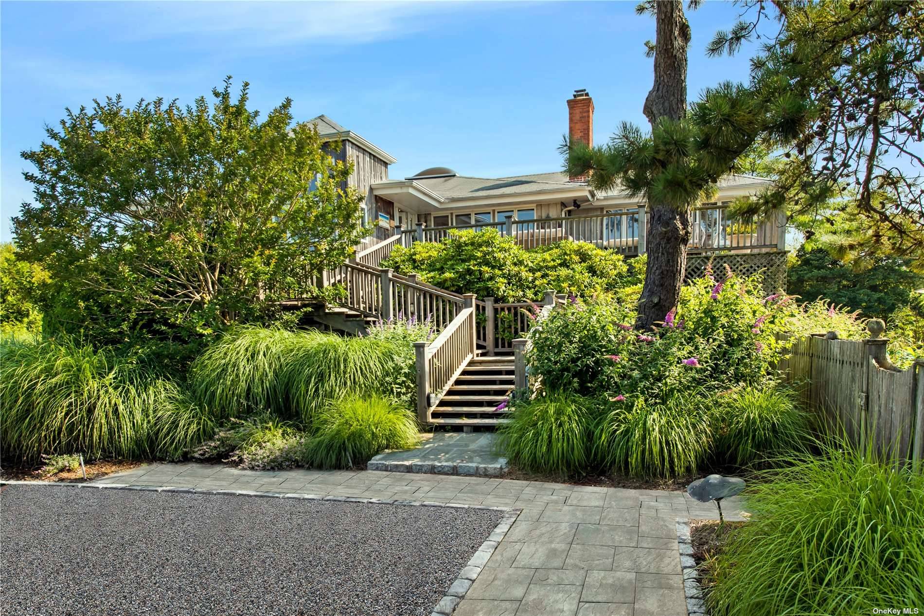 In the heart of Westhampton Beach Village, set down a long private driveway, across from the bay, this classic beach house features a heated, 20'x50' pool and Har tru tennis ...