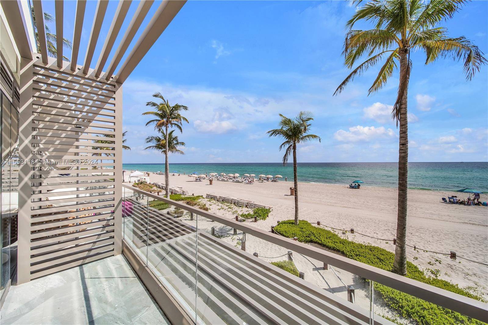 Stunning direct ocean view cabana at Residences by Armani Casa featuring stone tile floors throughout, bespoke window treatments, custom closets, under counter refrigerator and microwave.