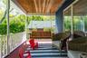 Inviting Covered Front Porch with Courtship Swing