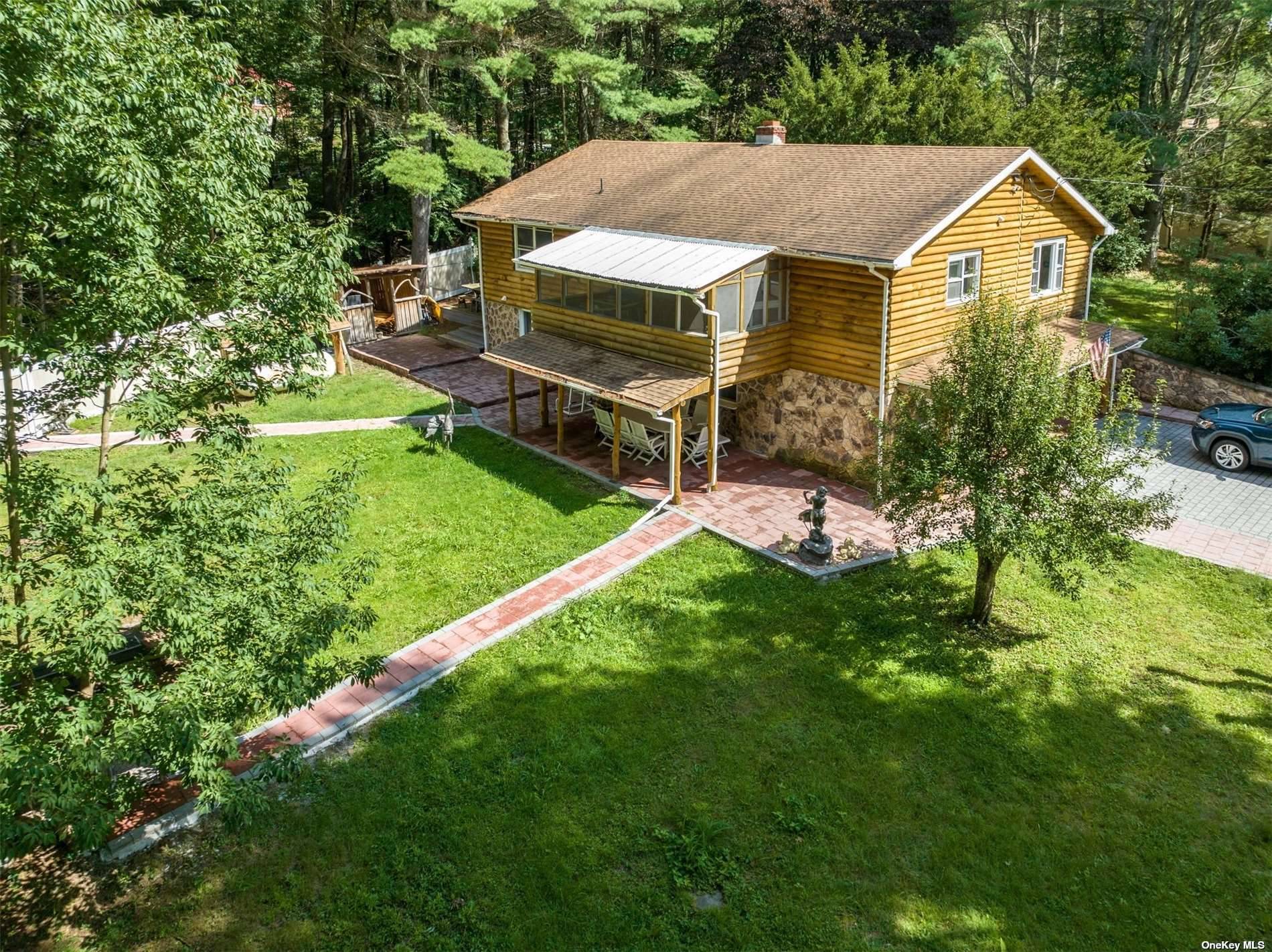 Nestled beside the serene shores of a beautiful lake, this upscale state house is a picture perfect retreat for those seeking a tranquil and spacious living experience.
