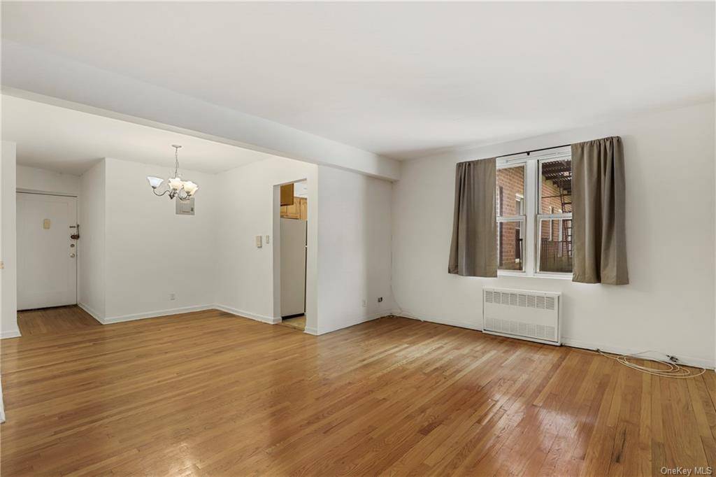 Welcome to this bright, freshly painted, one bedroom with hardwood floors throughout, large living room and dining foyer, good sized windowed kitchen, and lots of closet space.