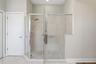 Walk-in shower and water closet in the primary bathroom