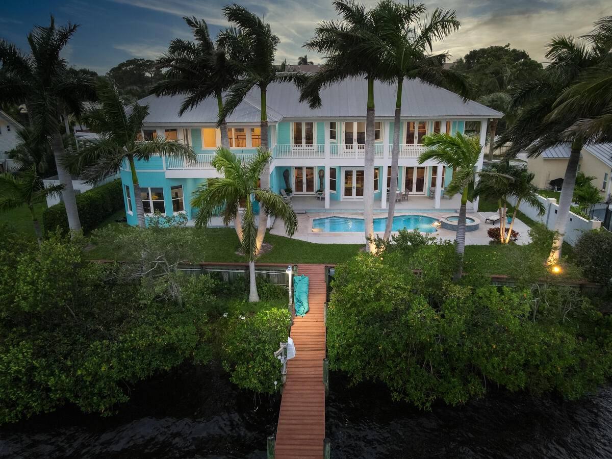 Panoramic Wide Water Views featured in this 2007 Key West Style Estate minutes to the St Lucie Inlet with No Fixed Bridges.
