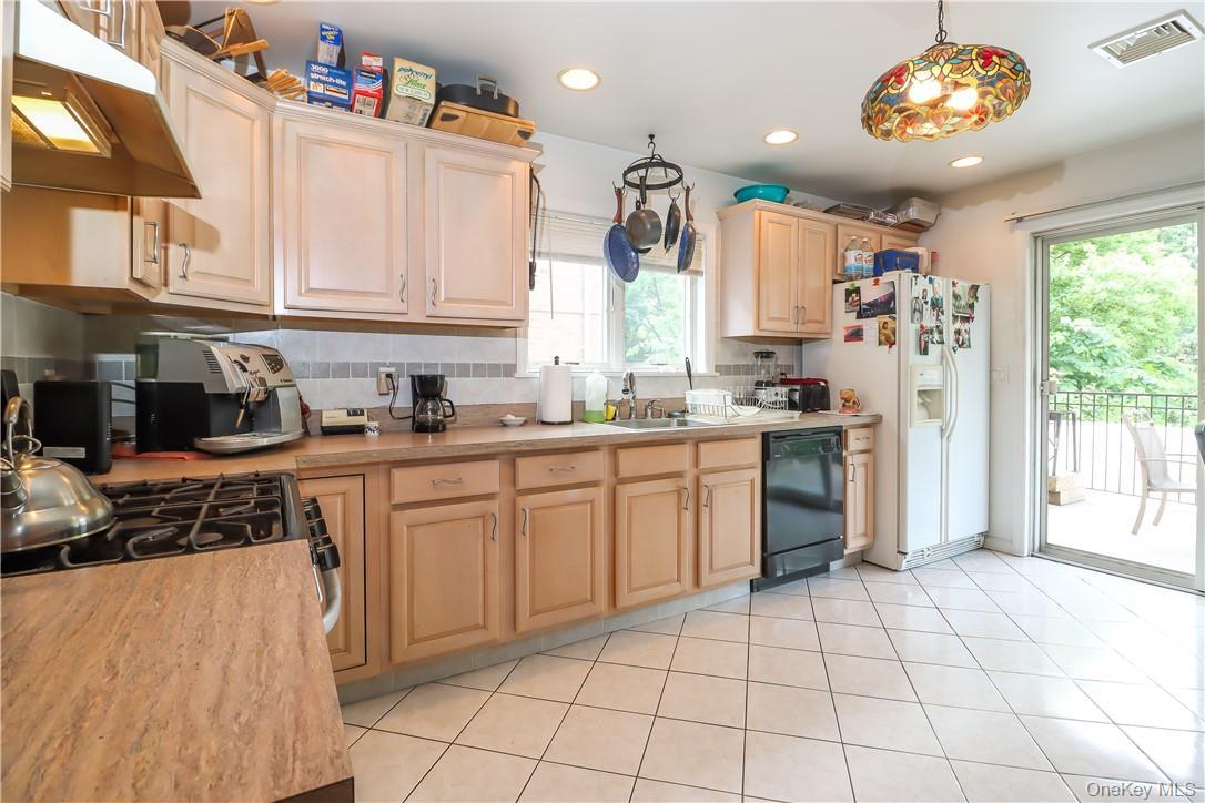 Spacious eat-in kitchen with tons of cabinet space for all your kitchen needs