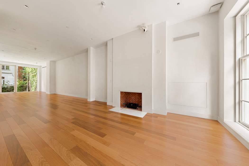 This beautiful 22 foot wide Greek Revival style brick elevatored townhouse is located in the historic neighborhood of Greenwich Village has undergone a 5 year renovation.