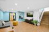 Finished Lower Level featuring stairs, recessed lighting, light wood-style flooring, wooden walls, and an accent wall