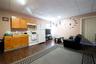 Kitchen with a paneled ceiling, sink, dark wood-type flooring, and white appliances