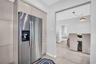 Stainless Steel Fridge with Crisp Cabinetry