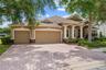 Pavered driveway, 3-car garage, and beautiful front elevation.