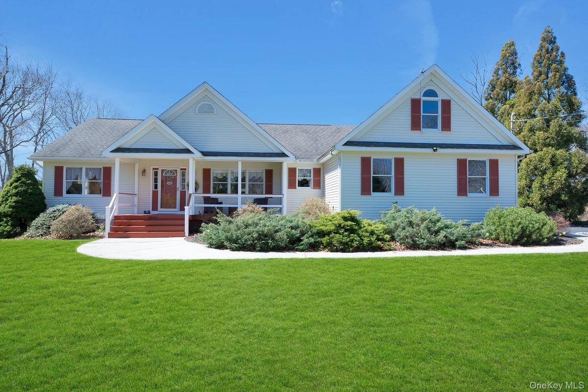View of Front of House with Covered Porch and Yard