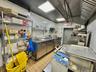 Kitchen with stainless steel counters and open shelves