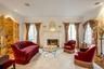 Living area featuring hardwood / wood-style flooring and crown molding