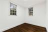 Spare room with baseboards, and dark wood finished floors
