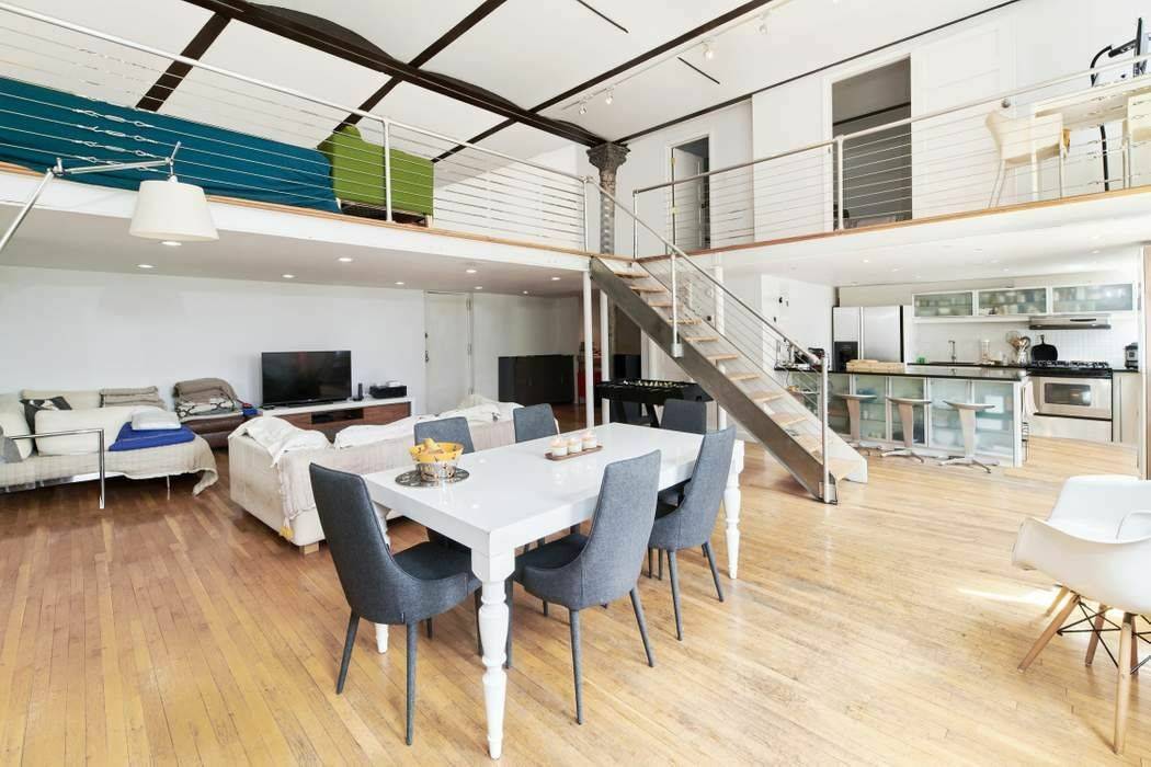 This sun drenched Duplex Loft at the Magnolia Mansion Lofts offers 14 ft.