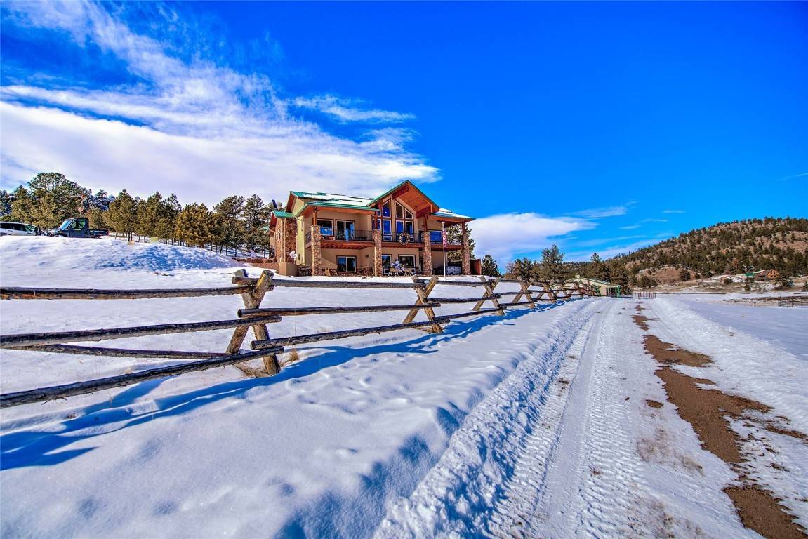 Whether you are looking for a beautifully appointed equine property or just the wide open spaces of Colorado's natural beauty, this expansive 35 acre retreat offers all that you've imagined.