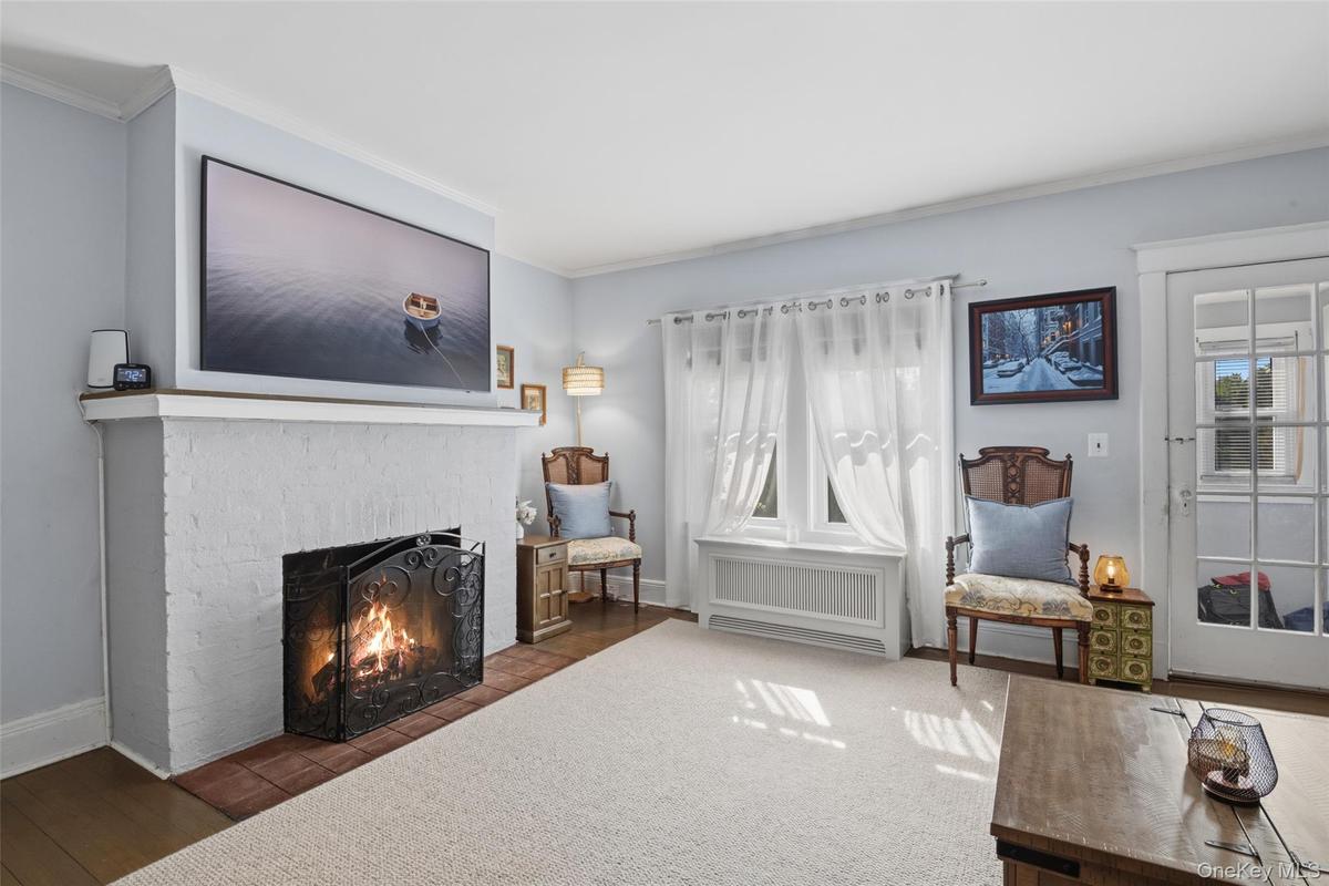 Living Room With Hard Wood Flooring and Fireplace (#220)
