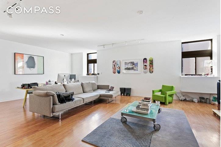 This 1029 sf converted 1 bedroom Nolita loft rental features an enormous living room and large dining area facing west onto Elizabeth Street.