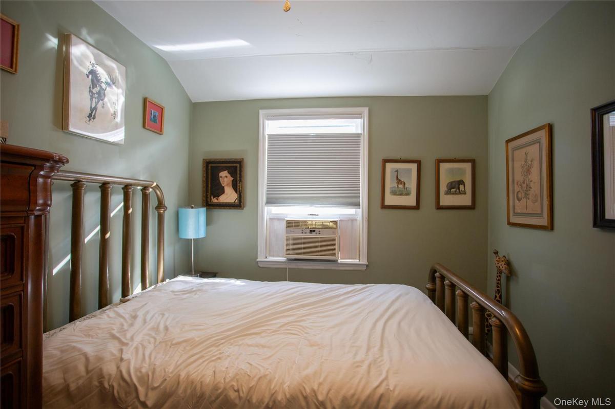 Bedroom with vaulted ceiling