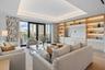 Spacious open concept living room with tongue and groove ceiling details and lighting