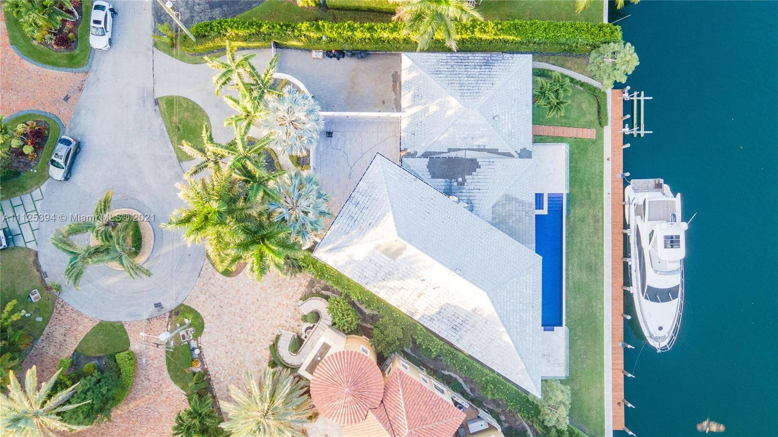 Located at the end of a cul de sac in the gated community of Sunrise Harbor, 6921 Sunrise Place is unquestionably one of the most exciting waterfront properties in South ...