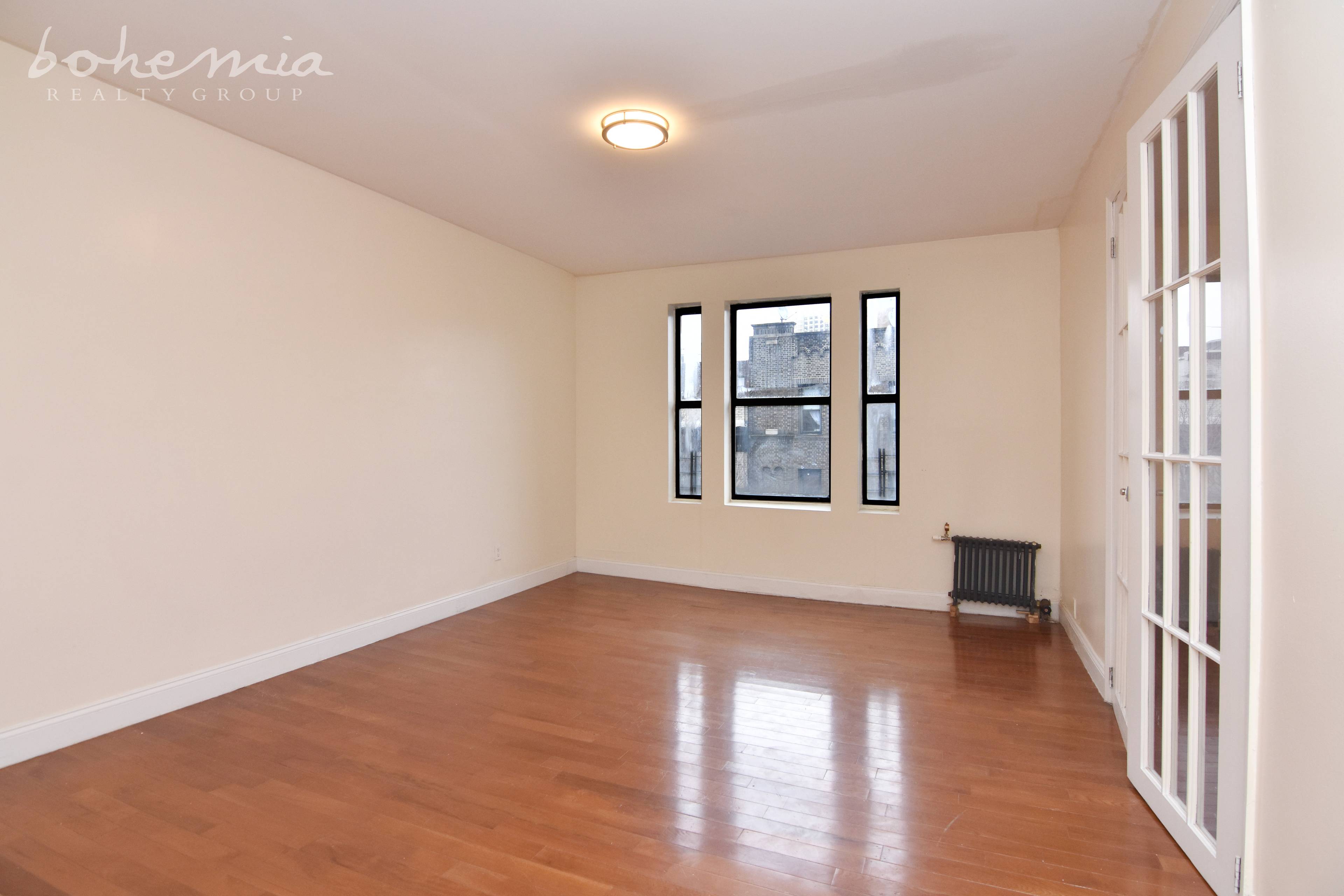 Renovated Washington Heights 3BR Convertible 4BR Featuring Hardwood Floors, SS Appliances, and Dishwasher.